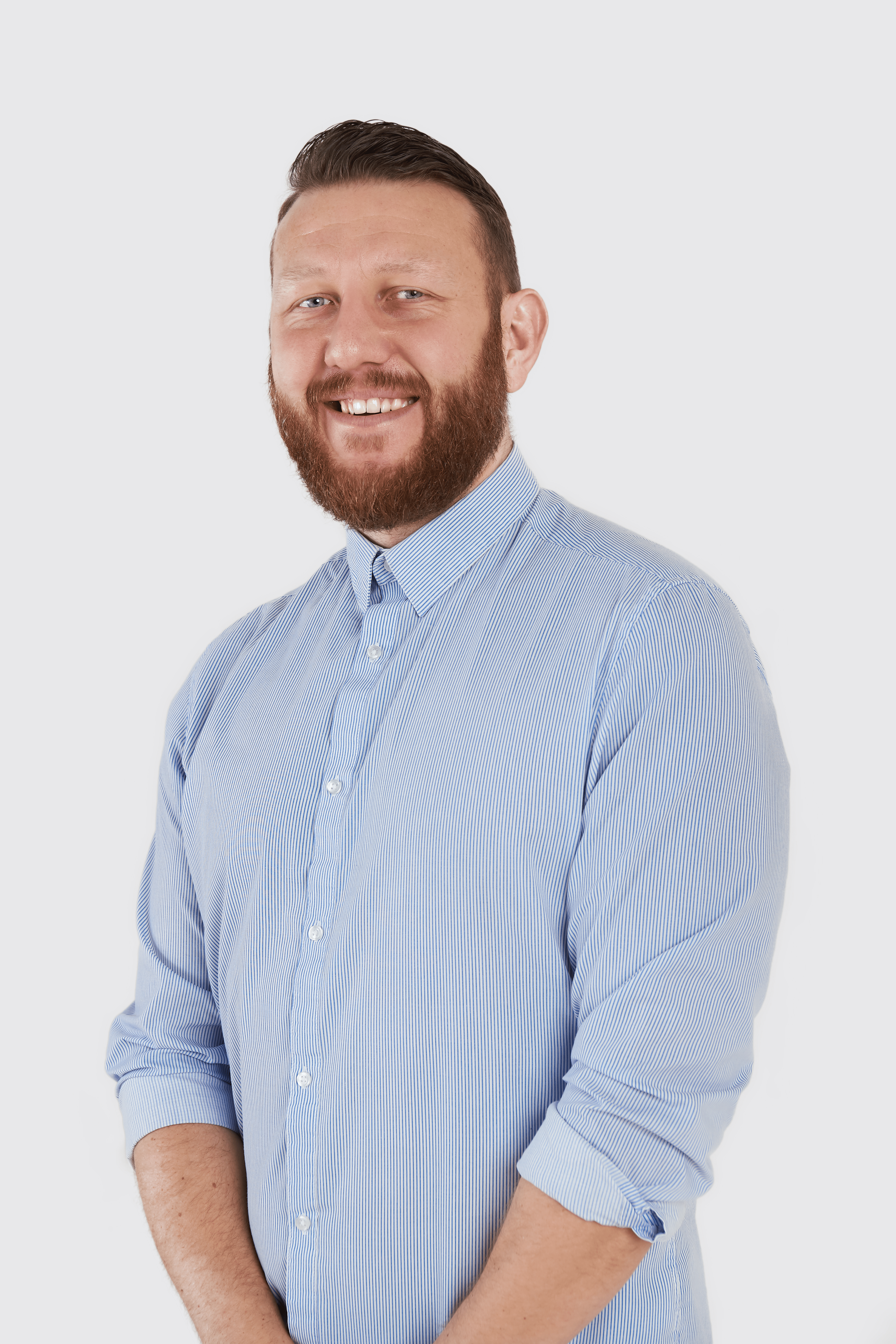 Rob Mole new Customer Success Manager at Clekt standing in blue shirt