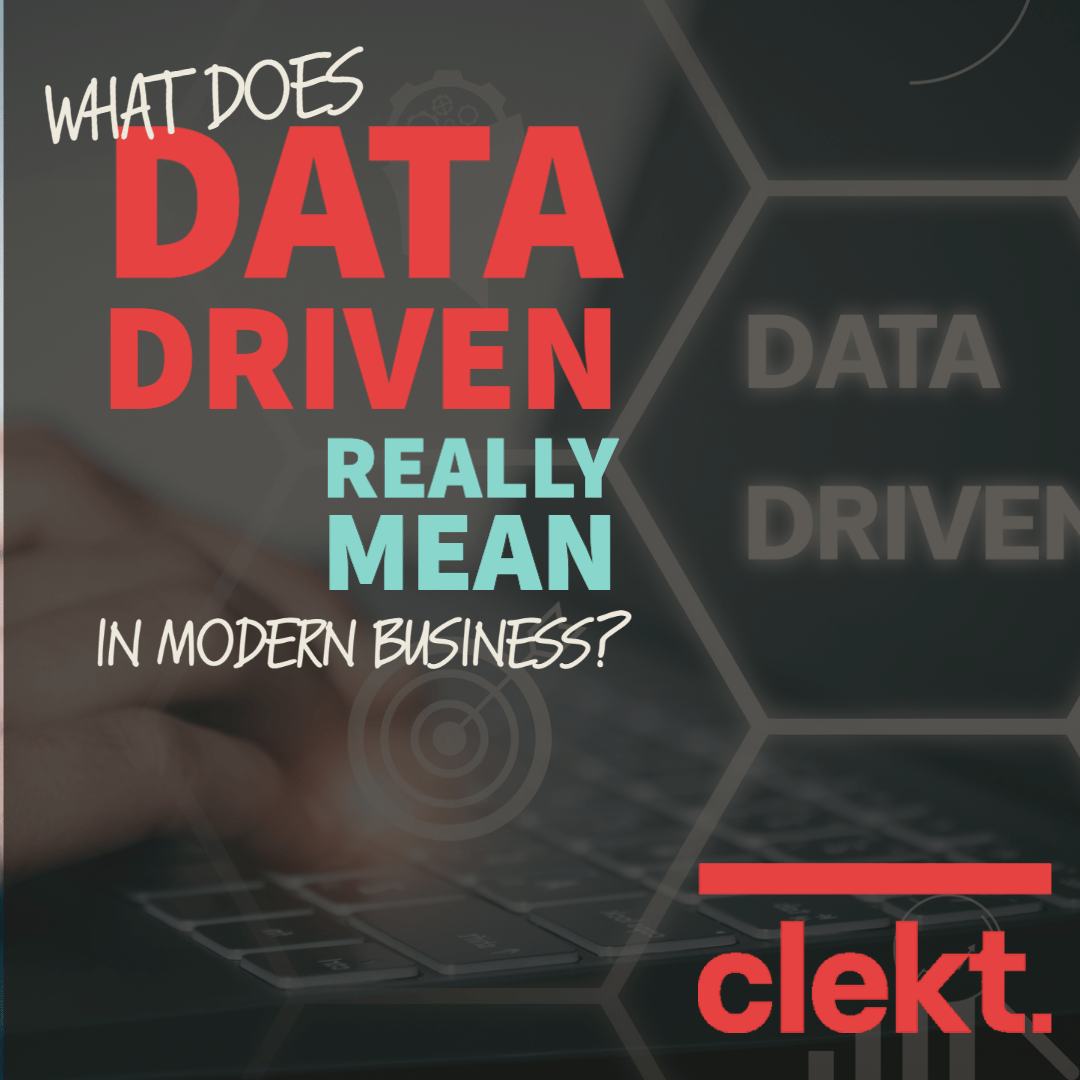 Text reads "What Does Data-Driven Really Mean In Modern Business?" over a dark image of hands using a computer keyboard and the Clekt logo below